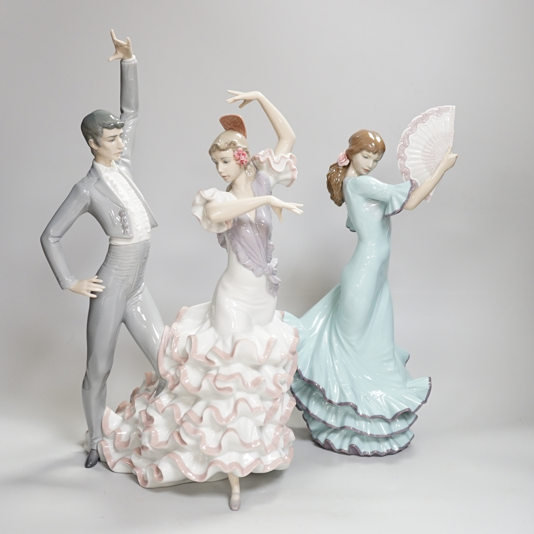 A Lladro centrepiece of two Spanish dancers, ‘A Passionate Dance’, boxed, together with another Lladro dancing figure with a fan, highest 43.5cm